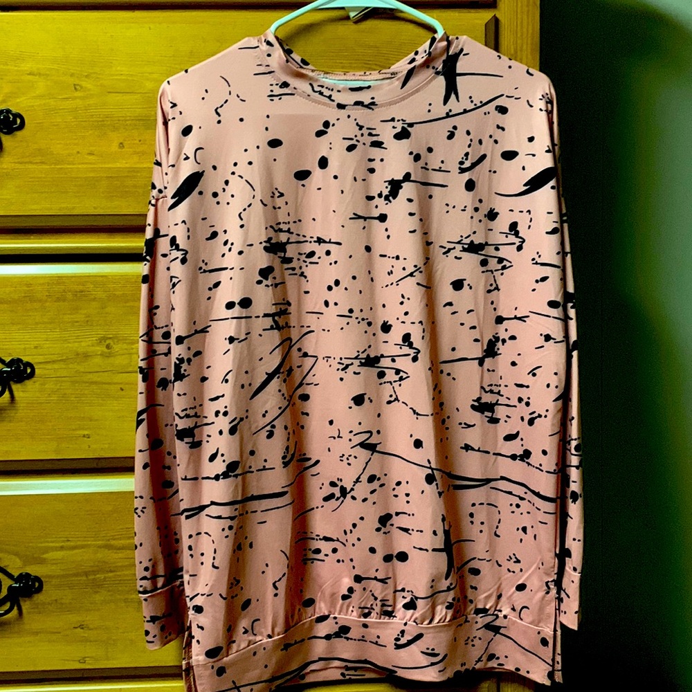 Pink long sleeve top with black paint splatter design